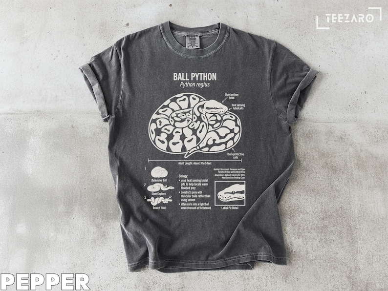 T-shirt with graphic of a ball python coiled, detailing anatomy and behaviors.