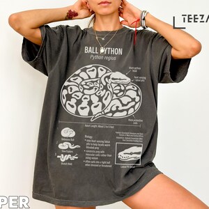 T-shirt with a graphic of a ball python and its biology and habitat information.
