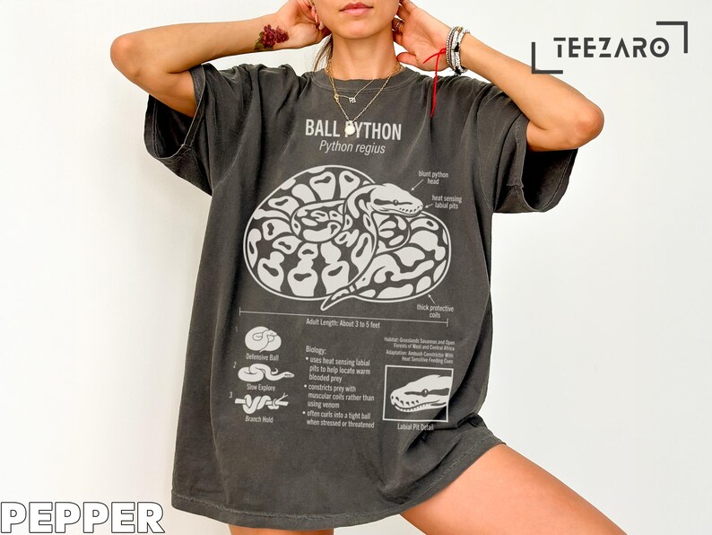 T-shirt with a graphic of a ball python and its biology and habitat information.