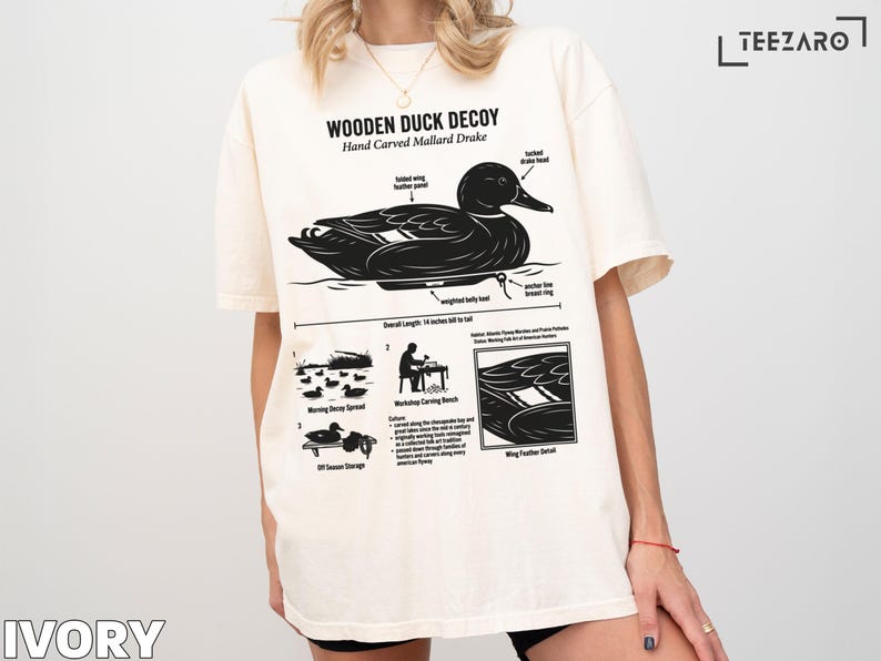 Wooden duck decoy illustration with text details on a t-shirt.