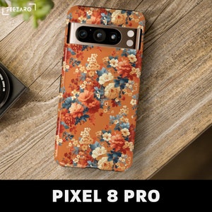 May include: A floral phone case with a brown background and orange, white, and blue flowers. The case is designed for a Pixel 8 Pro phone.