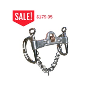 May include: A silver horse bit with a chain and a copper roller. The bit has a D-ring on each side and a curved mouthpiece.  SALE! $179.95