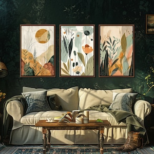 May include: Three abstract art prints with a nature theme. The prints feature a variety of colours, including green, brown, orange, and yellow. The prints are framed in a dark wood frame and are hanging on a dark green wall.