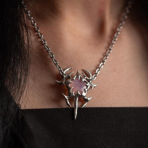 Y2k magic wand inspired pendant necklace with a star shaped pink resin gem