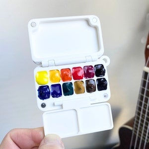 Acuarelas de artista Holbein en paleta de viaje, portátil, plein air, 12 cuadrículas, diseño con clip para carpeta