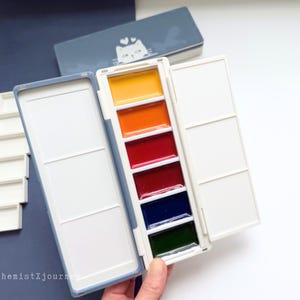 Kuretake 6-panspalet AX9: geglazuurd keramiek, verwijderbaar modulair raster, magnetische sluiting, draagbaar aquarel reisetui