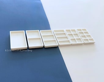 Pastilhas Slim Kuretake: Pastilhas de aquarela leves, ideais para viagens e kits compactos.