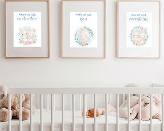 May include: Three framed wall art prints featuring watercolor illustrations of bunnies with floral accents. The first print reads "FIRST WE HAD EACH OTHER," the second "THEN WE HAD YOU," and the third "NOW WE HAVE EVERYTHING" in blue text.