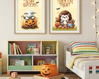 May include: Two framed wall art prints featuring a lamb in a pumpkin with the text Stay Spooky and a hedgehog with the text Trick or Treat, displayed above a wooden bookshelf containing books and a plastic pumpkin bucket on a wooden cart.