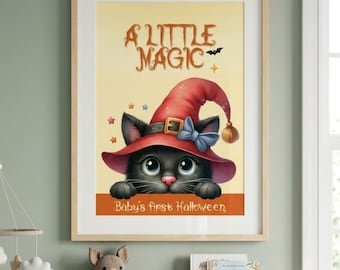 May include: A framed wall art print featuring a black cat wearing a red witch hat with a blue bow. The text reads A LITTLE MAGIC at the top and Baby's first Halloween at the bottom. The background is a soft yellow with small colorful stars.
