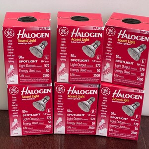 May include: Six red boxes of GE Halogen Accent Light bulbs. Each box displays a spotlight image, with text indicating 50W, 570 lumens, and a 2500-hour life. The boxes are stacked on top of each other.