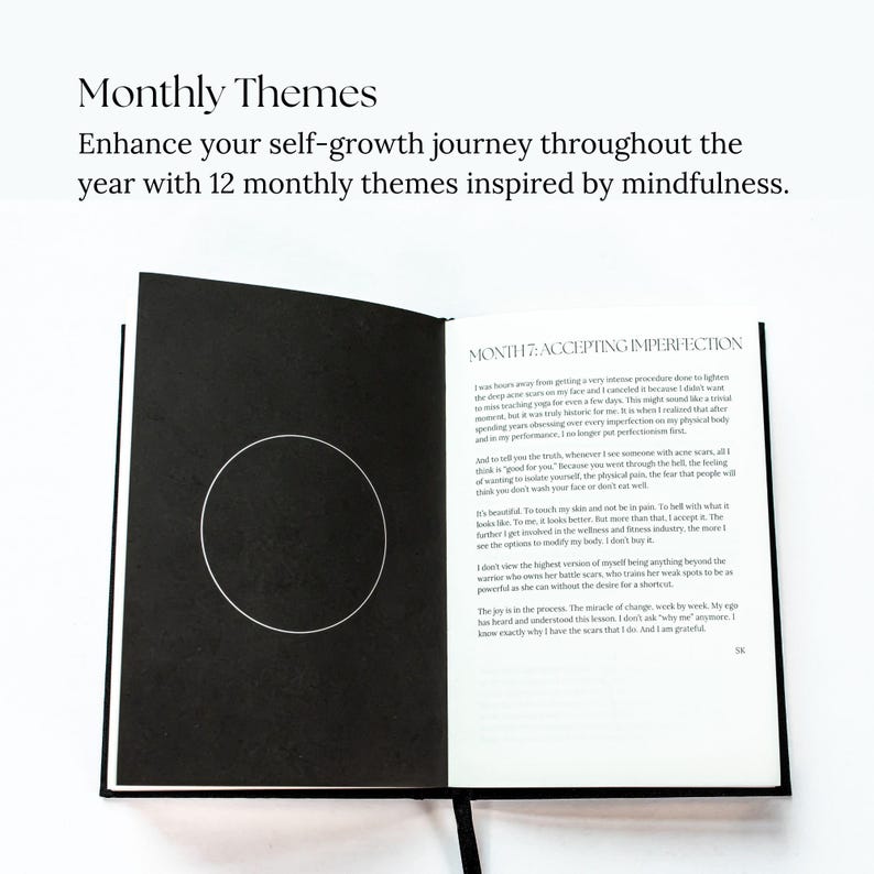 May include: Open black and white journal with the text "MONTH 7: ACCEPTING IMPERFECTION" and a quote about accepting imperfections. The journal is open to a page with a circle in the center.