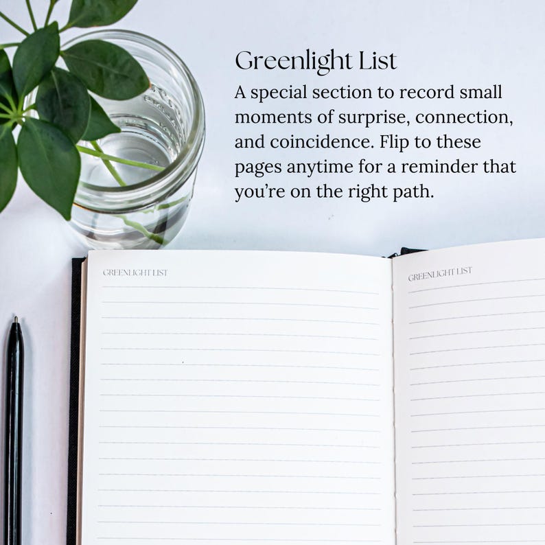 May include: An open notebook with lined pages and the text "Greenlight List" at the top of each page. The text below the title reads "A special section to record small moments of surprise, connection, and coincidence. Flip to these pages anytime for a reminder that you're on the right path."