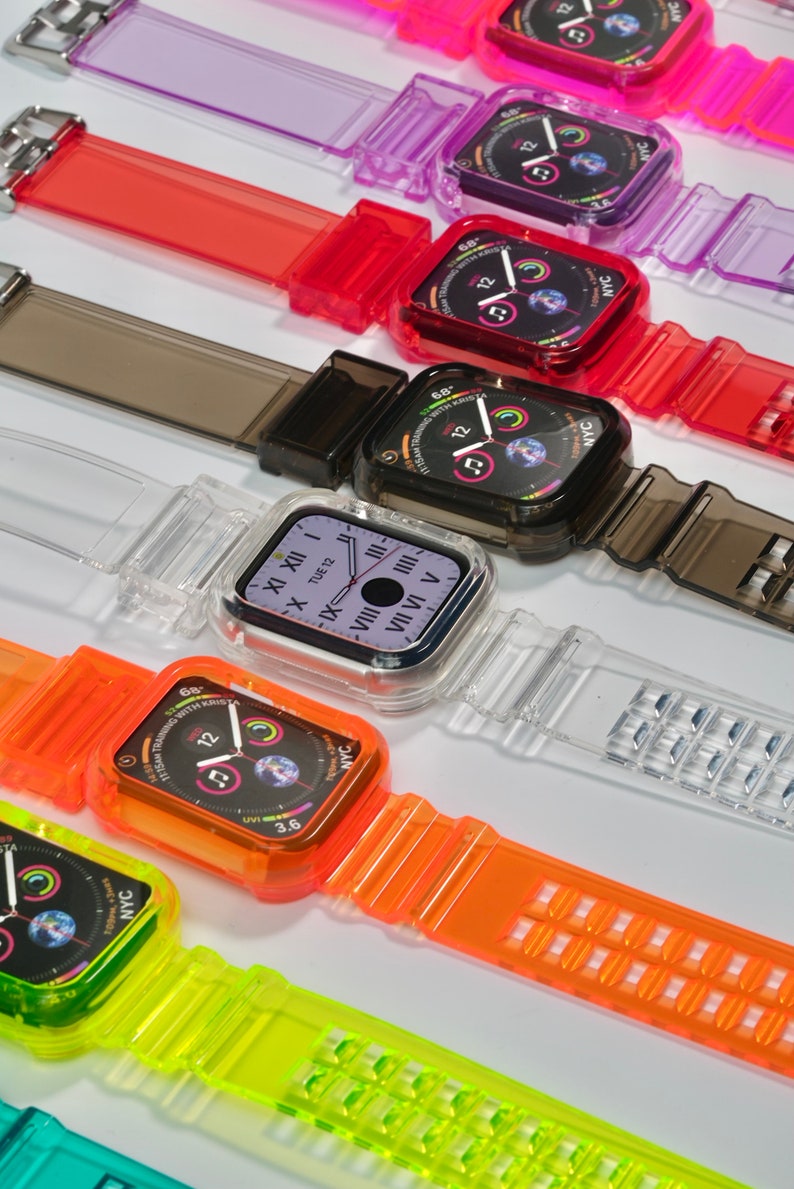 May include: A set of colorful clear plastic watch bands with different colored watch faces. The watch faces show the time, date, and other information. The bands are all made of clear plastic and have a variety of colors, including red, orange, yellow, green, blue, purple, and black.