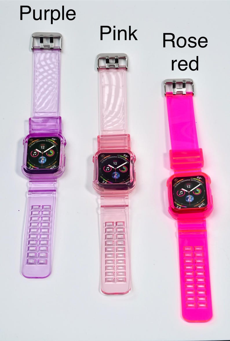 May include: Three Apple Watch bands in different colors: purple, pink, and bright pink. The bands are made of clear, flexible silicone with a textured pattern. Each band has a silver buckle.