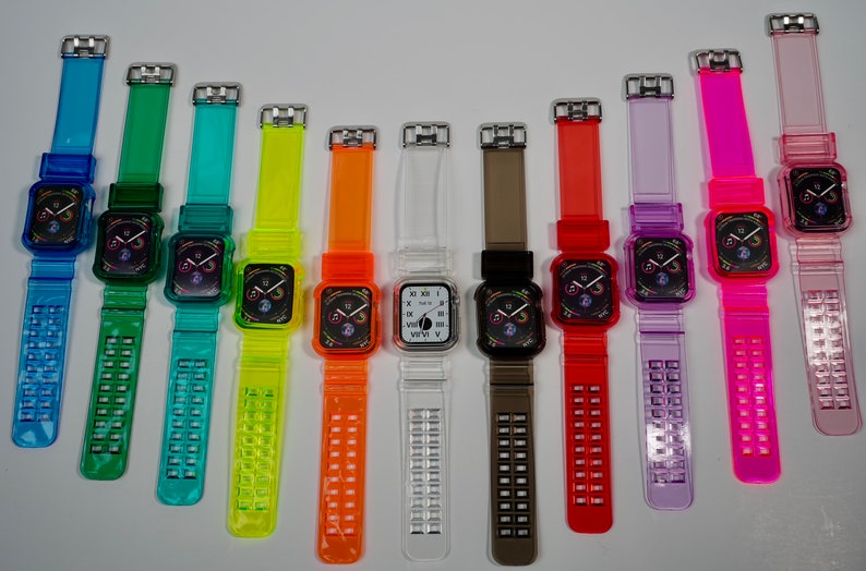 May include: A set of 10 colorful clear silicone watch bands for Apple Watch. The bands are in various colors, including blue, green, yellow, orange, red, purple, and pink. The bands have a clear, translucent design with a grid pattern.