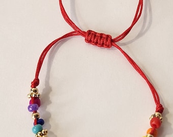 evil eye bracelet  with St. Benedict charm