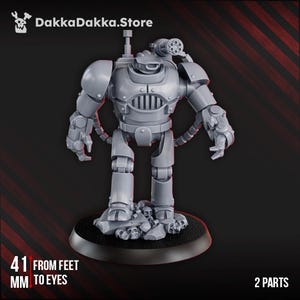 May include: A grey, two-part miniature robot figure with a gun on its shoulder, standing on a black base with skulls. The figure is 4.1 cm from feet to eyes. The DakkaDakka.Store logo is in the top left corner.