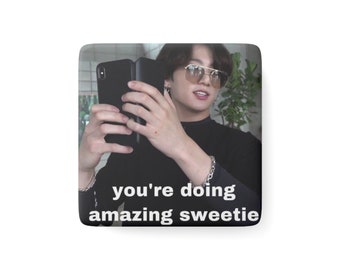 May include: A meme image featuring a man wearing sunglasses and a black shirt, holding a phone and looking at the camera. The text "you're doing amazing sweetie" is written below the image.