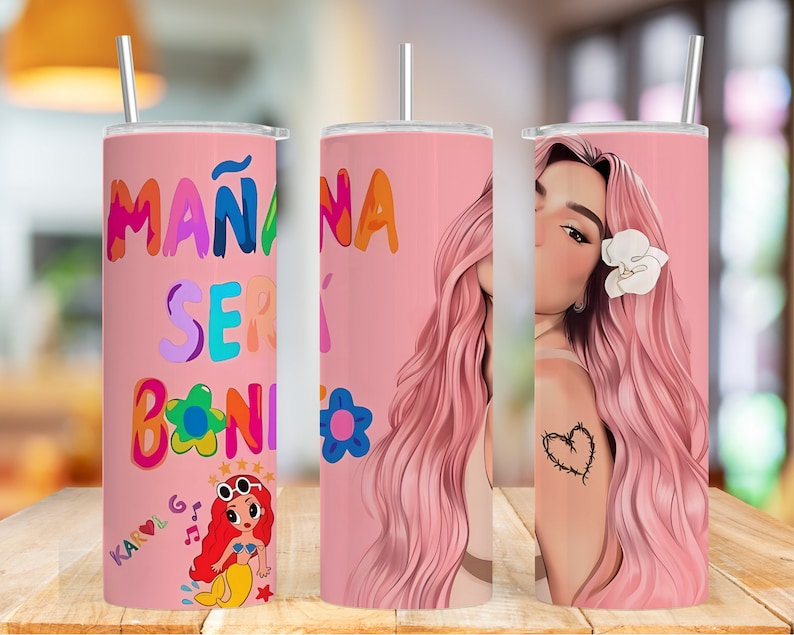 K&ouml;nnte beinhalten: Ein rosa Edelstahlbecher mit einem bunten Design mit dem Text "MA&Ntilde;ANA SER&Aacute; BONITO" und einer Comic-Meerjungfrau. Der Becher hat einen wei&szlig;en Strohhalm.