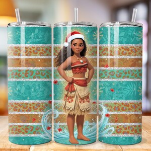 May include: A tumbler featuring a design with a cartoon character wearing a Santa hat. The tumbler has a teal background with white and silver stripes, and a leopard print pattern. The tumbler includes a straw.
