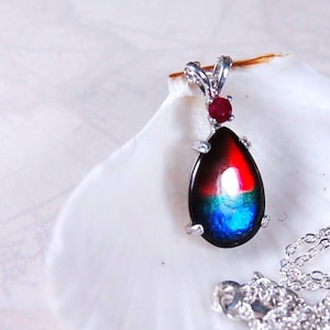 Ammolite Jewelry Pendant.Rich bright colors. Perfect Birthday gift.Ruby companion stone.Top Quality Canadian ammolite.See details below.