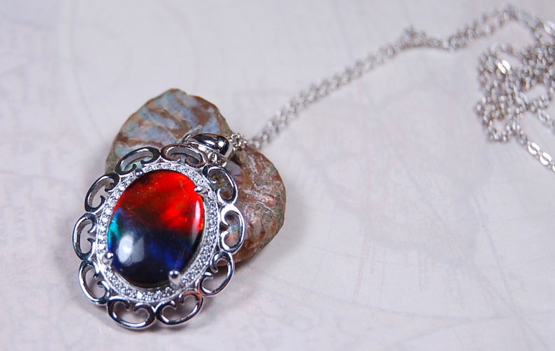 Spectacular Ammolite jewelry pendant rich in reds and blues.Grade AA.#123017