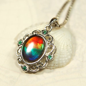 Ammolite pendant.Petite but makes a BIG impression.Gift for her?Perfect high quality rainbow gem.Christmas gift?Must see video.120213