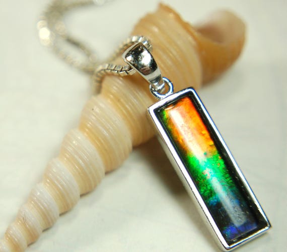 Lovely Ammolite pendant - the perfect gift for someone special.Sterling Silver plated with Rhodium so allergy free.MUST see video.052415