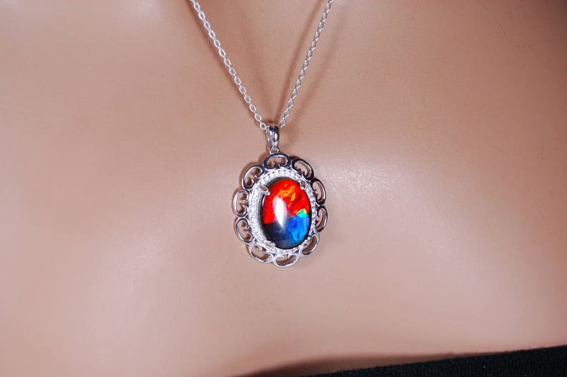 Spectacular Ammolite jewelry pendant rich in reds and blues.Grade AA.#123017