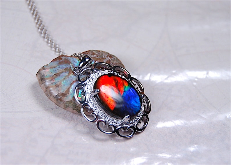 Spectacular Ammolite jewelry pendant rich in reds and blues.Grade AA.#123017