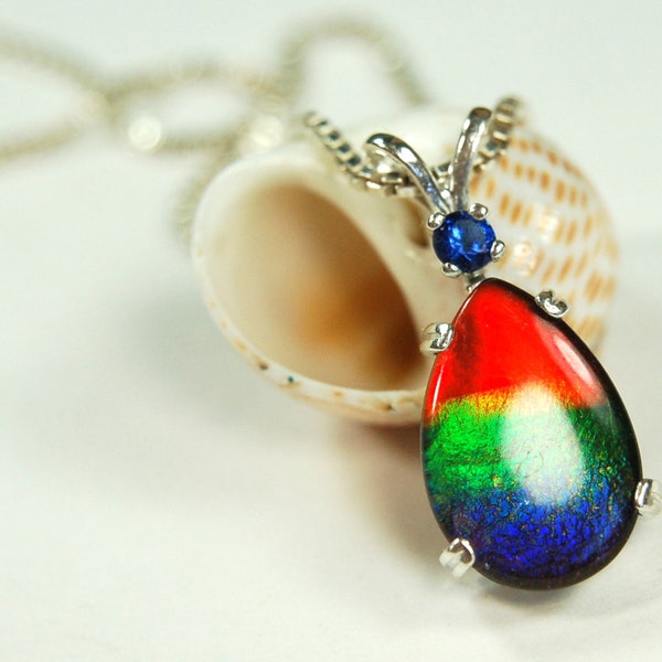 Ammolite Rainbow Pendant with Sapphire.Ammolite jewelry from Canada.See details, images and video below.#012212