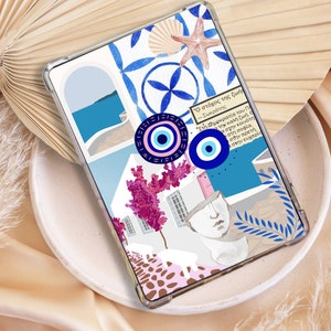 May include: A phone case with a colorful collage design featuring a blue and white eye symbol, pink flowers, and a quote in Greek. The quote reads "Ο στόχος της ζωής - Σωκράτης" which translates to "The goal of life - Socrates".
