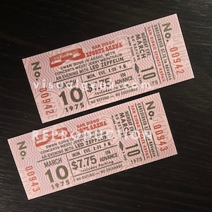 May include: Two vintage concert tickets from the San Diego Sports Arena, featuring a Led Zeppelin performance on March 10, 1975. The tickets are pink with black text, including the price and event details.