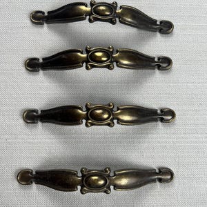 Set of 4 curved vintage drawer pulls Antique brass