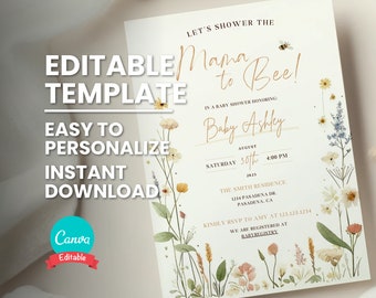 Puede incluir: Una invitación de baby shower blanca con un diseño floral y letras doradas. El texto dice "Let's shower the Mama to Bee!" y "Baby Ashley". La invitación incluye la fecha, la hora y la ubicación de la ducha.
