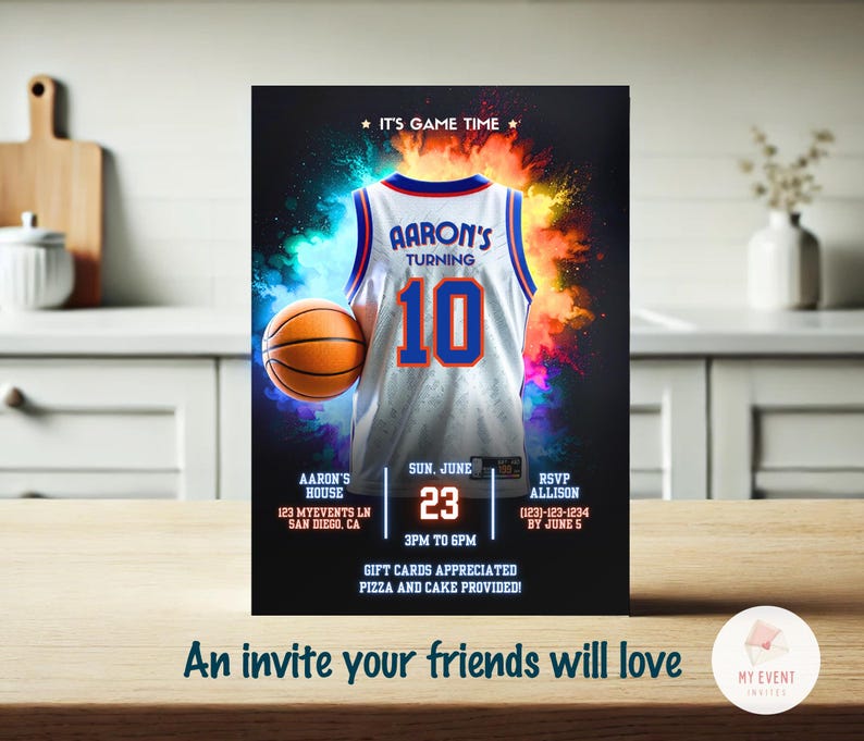 May include: A basketball-themed birthday party invitation with a white basketball jersey with blue and orange accents. The jersey has the text "AARON'S TURNING 10" on the front. The invitation includes details about the party, including the date, time, location, and RSVP information.