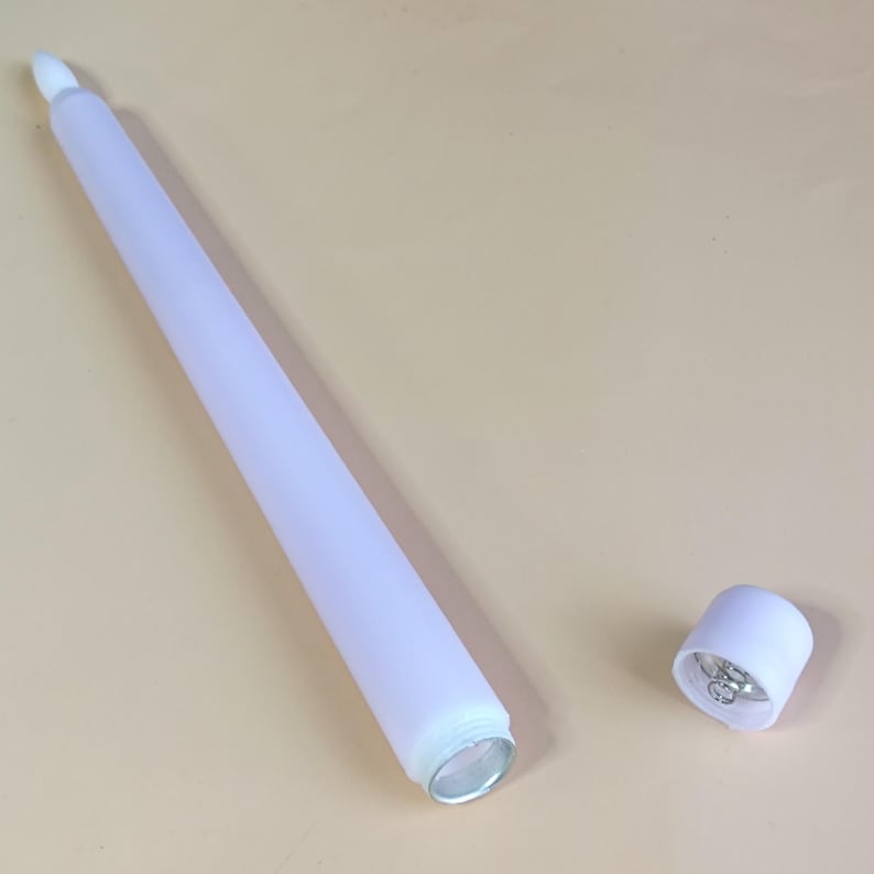 May include: A white ceramic mug with a black handle and the text "But First, Coffee" in a black, bold font. The mug is on a white surface.