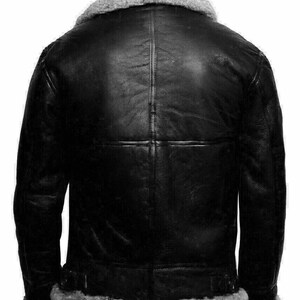 May include: A black leather bomber jacket with a shearling collar and lining. The jacket has a zipper closure and two pockets.