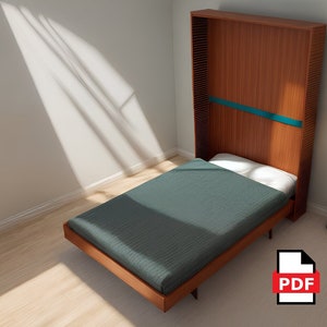 May include: A wooden wall bed with a teal accent strip, folded up and against the wall. The bed is made with a dark gray bedspread and white pillow. The bed is in a room with a wooden floor and a lamp in the background.