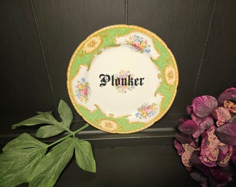 Plonker China side plate with Black vinyl lettering