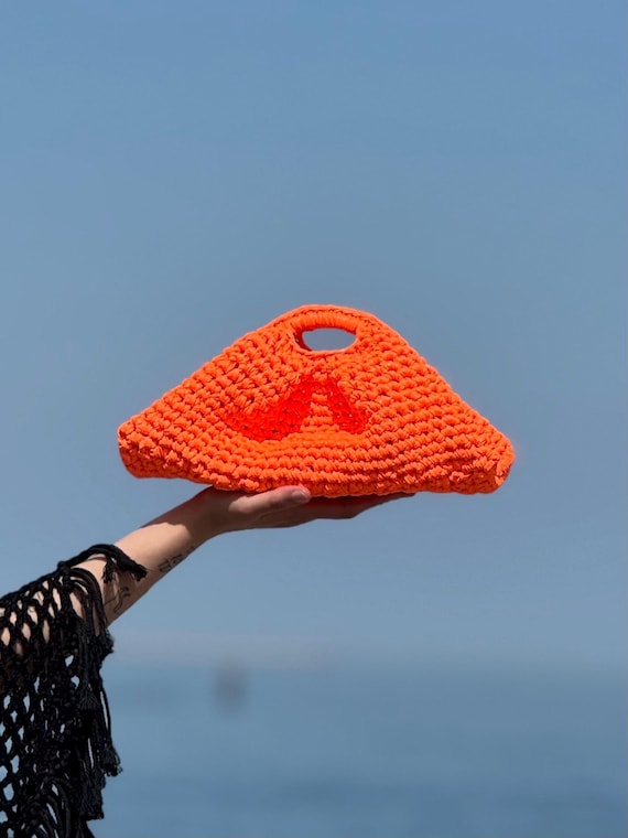 fluorescent orange clutch