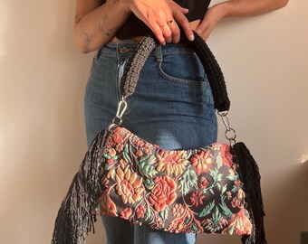Bag in floral brocade fabric and rope handle with fringes