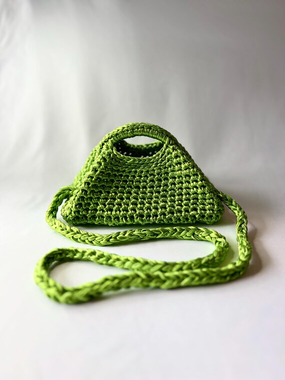 Acid green clutch with shoulder strap