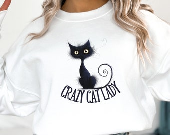 Crazy cat lady graphic sweatshirt design | Humorous unisex white shirt for cat lovers | Whimsical blue feline digital art illustration tee