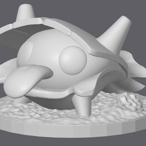 May include: A white 3D printed model of a cartoon creature with a shell, large eyes, and a long tongue. The creature is standing on a textured base.