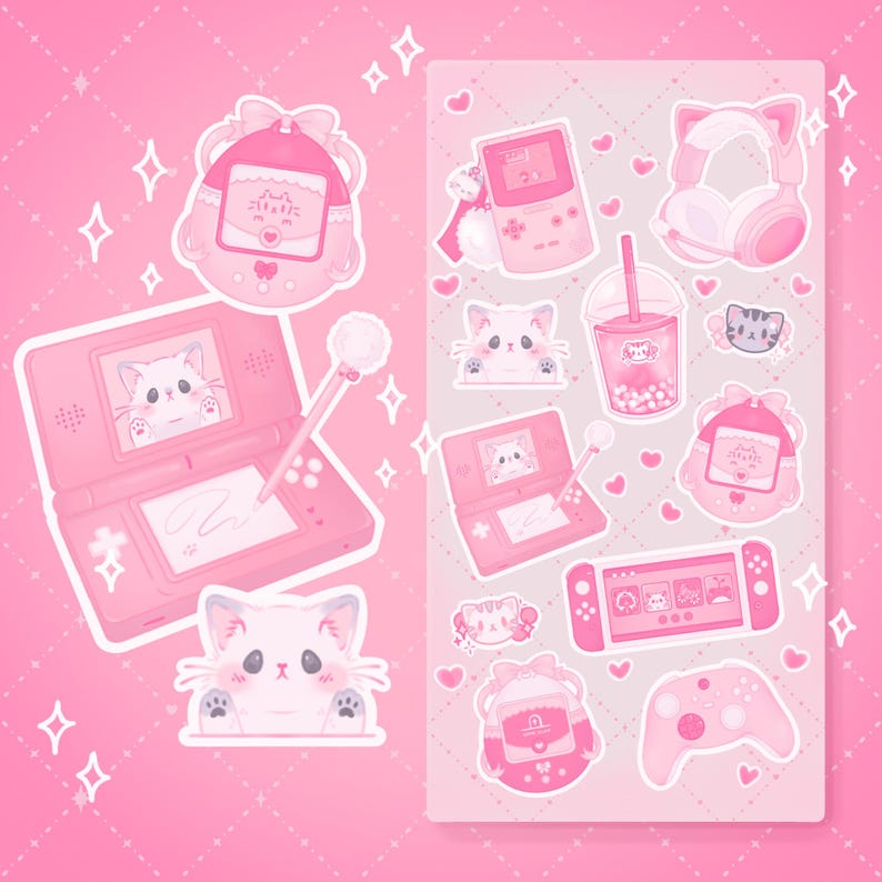 May include: A sheet of pink stickers featuring cute cartoon characters and gaming-themed designs. The stickers include a pink handheld gaming console, a cat, a headset, a drink, and a game cartridge.