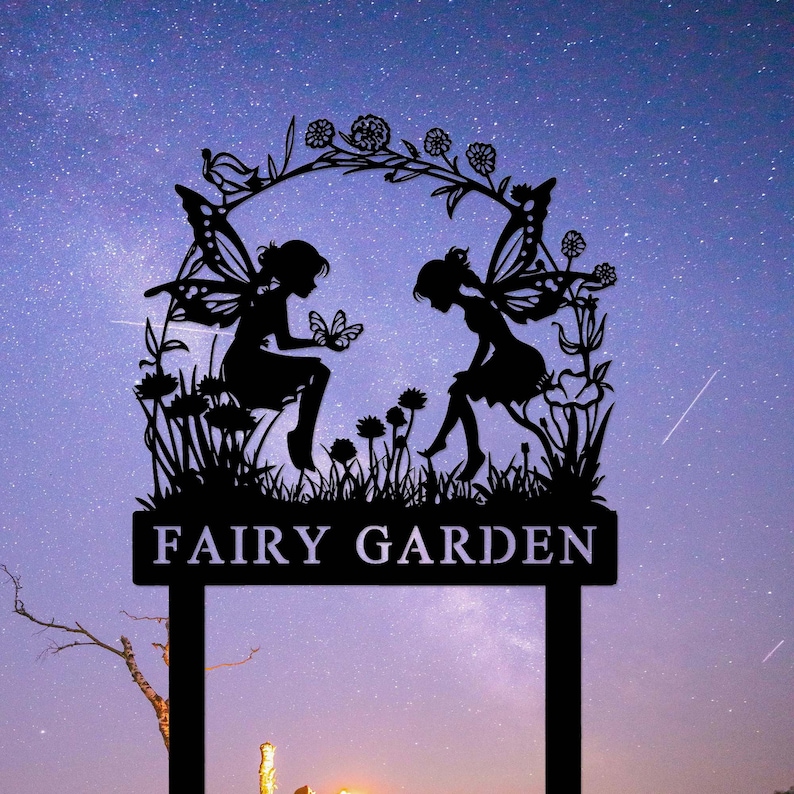 May include: Black metal silhouette of two fairies with wings, sitting on a bed of flowers, with the text "Fairy Garden" on a sign below. The silhouette is set against a starry night sky.
