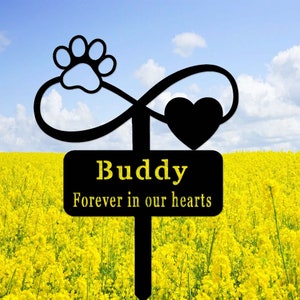 May include: Black metal garden stake with an infinity symbol, a paw print, and a heart. The stake has a black sign that reads "Buddy Forever in our hearts".