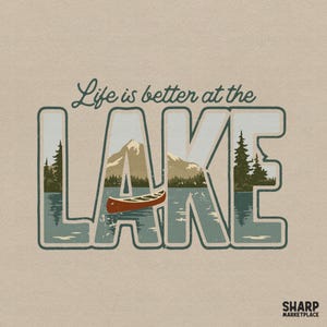May include: A beige graphic tee with the text "Life is better at the LAKE." The word "LAKE" is filled with a scenic illustration of a lake, mountains, trees, and a canoe. The tee has a vintage, distressed look.